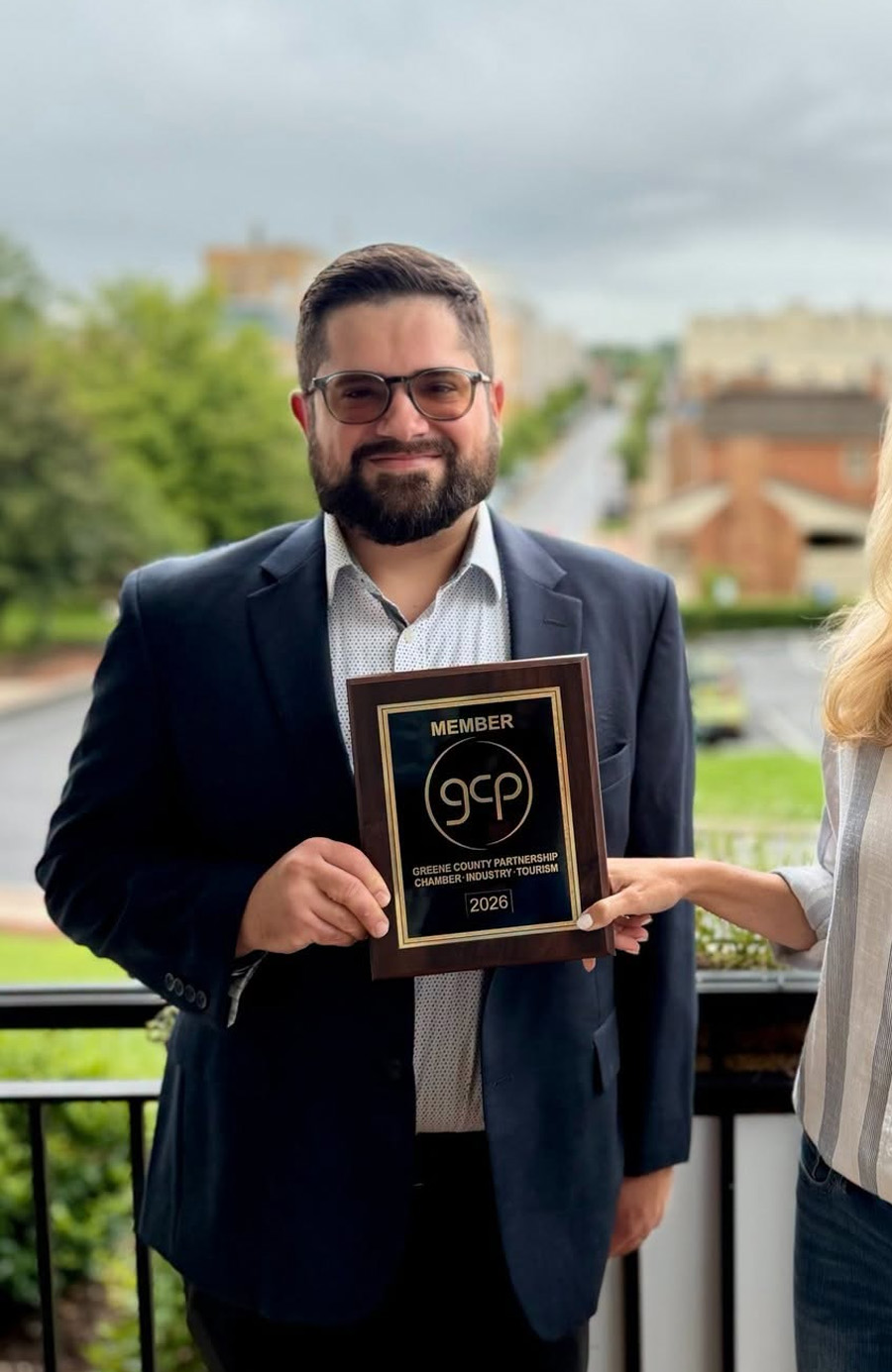 Brian holding the Greene County Partnership membership plaque