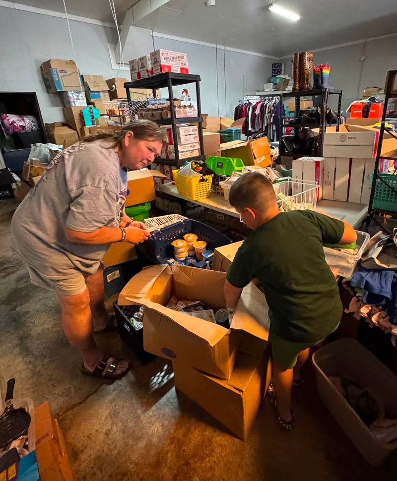 Volunteers sorting donated food and clothing at Hunger First Greeneville